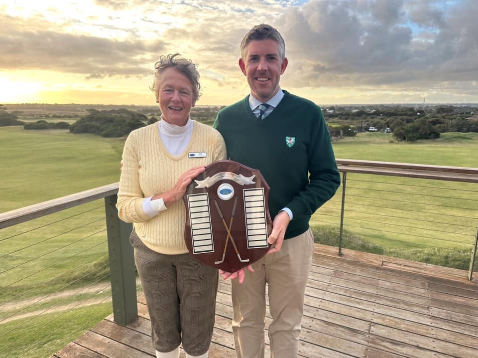 Inaugural champions Kim Hastie and Harry Green holding the Victorian Hickory Shaft Championships trophy at Barwon Heads